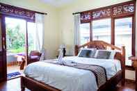 Bedroom Rizky Guesthouse by ecommerceloka