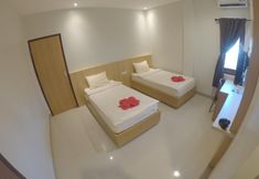 Bedroom 4 Sunnyday Inn Merauke
