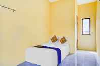 Kamar Tidur SPOT ON 90701 Kost Syariah Deris