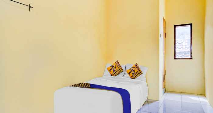 Kamar Tidur SPOT ON 90701 Kost Syariah Deris