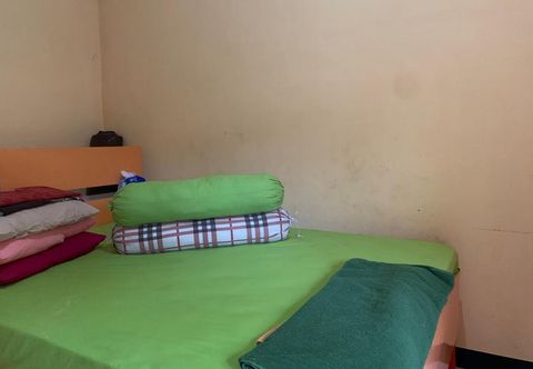 Bedroom OYO 90770 Wisma Rima Melati