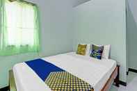 ห้องนอน SPOT ON 90760 Homestay Al Madina Syariah