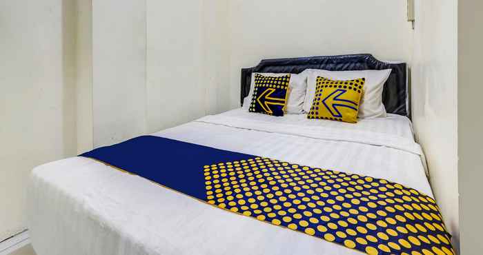 Kamar Tidur SPOT ON 90780 Gang Tengah Homestay Syariah