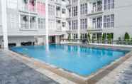 Swimming Pool 5 Chic and Cozy Studio Room at Taman Melati Surabaya Apartment By Travelio