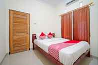 Bedroom OYO 90869 Happy Homestay Syariah