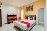 Kamar Tidur OYO 90935 Rumah Kost Metroliving