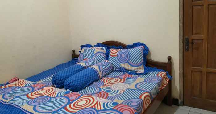 Kamar Tidur OYO Homes 91083 Desa Wisata Plosokuning Syariah