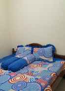 BEDROOM OYO Homes 91083 Desa Wisata Plosokuning Syariah