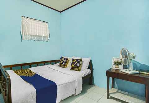 Bedroom OYO Homes 91089 Desa Wisata Air Terjun Way Kalam Syariah