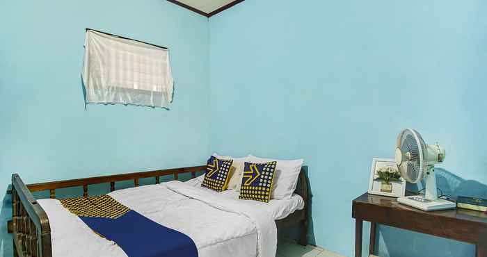 Bedroom OYO Homes 91089 Desa Wisata Air Terjun Way Kalam Syariah