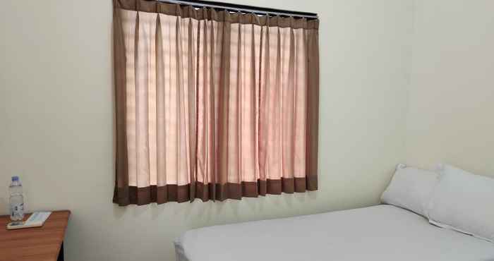 ห้องนอน OYO 91126 Kertajaya Residence Surabaya