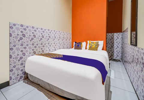 卧室 SPOT ON 91186 Losmen Yanti