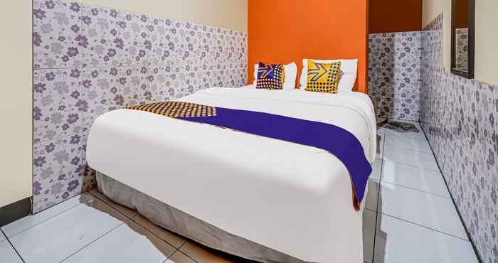 Kamar Tidur SPOT ON 91186 Losmen Yanti