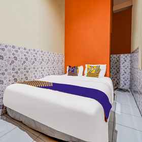 Bedroom 1 SPOT ON 91186 Losmen Yanti, โรงแรม & ที่พัก Cv. Sumber Jaya Maxima