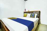 Bedroom OYO HOMES 91242 Desa Wisata Cibuntu Kuningan