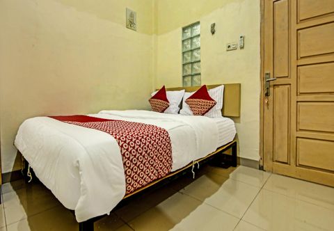 ห้องนอน OYO 91268 Homestay Bu Erma Syariah