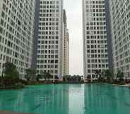 Swimming Pool 5 Simply and Comfort 2BR at M-Town Residence Apartment By Travelio