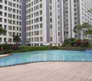 Swimming Pool 6 Simply and Comfort 2BR at M-Town Residence Apartment By Travelio