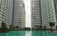 Swimming Pool 5 Elegant 1BR at M-Town Residence Apartment near Summarecon Mall By Travelio