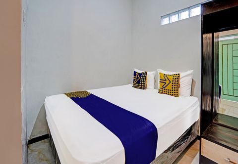 臥室 SPOT ON 91323 Omah Victoria Homestay & Culinary