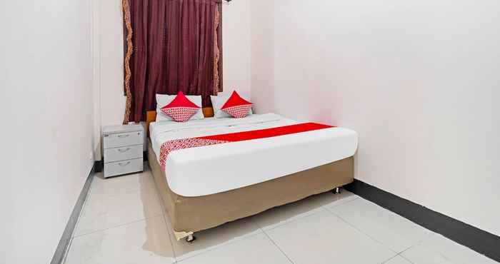 Phòng ngủ OYO 91322 Jawara Guest House Syariah