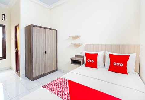 Bedroom OYO 91332 City-m Urban Homestay Syariah