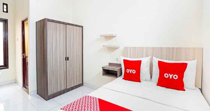 Bedroom OYO 91332 City-m Urban Homestay Syariah