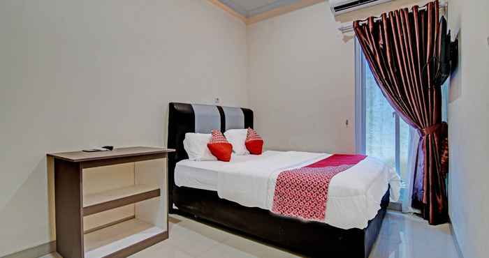 Kamar Tidur OYO 91269 R&s Living Residence