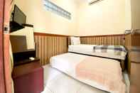 Bedroom Homey Guesthouse near Sby Zoo (Syariah)