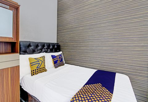 Kamar Tidur SPOT ON 91523 Kenari Guesthouse