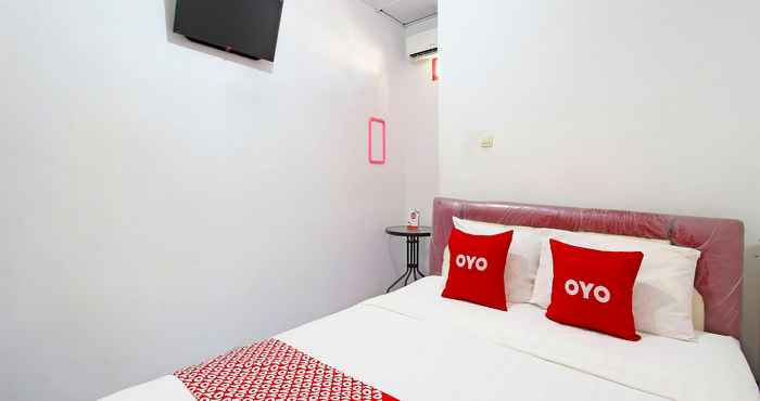 Bedroom OYO 91474 Srikaya Hotel 1