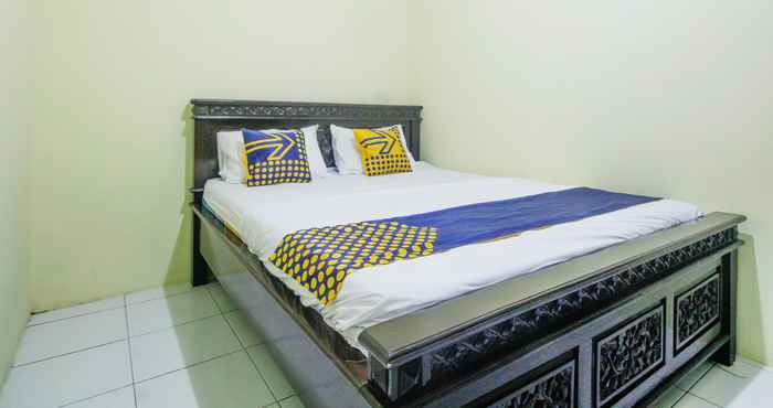 Bedroom SPOT ON 91606 Nadin Guest House Syariah
