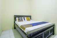 Bedroom SPOT ON 91606 Nadin Guest House Syariah