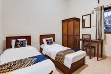 Phòng ngủ SPOT ON 91752 Izzami Homestay Syariah