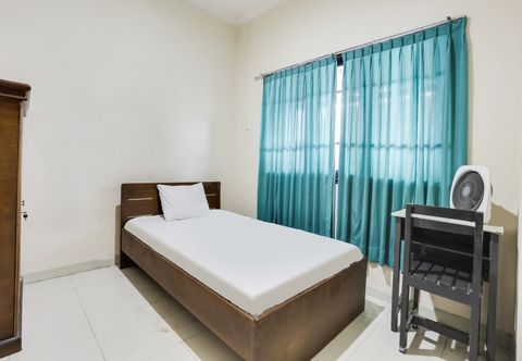 臥室 SPOT ON 91770 441 Pemuda Homestay