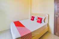 ห้องนอน OYO 91755 Priska Kost Dan Homestay