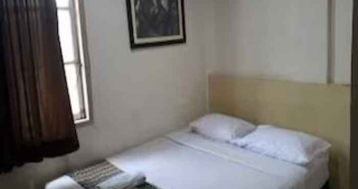 Bedroom EXPRESS O 91674 Penginapan Bm Prima