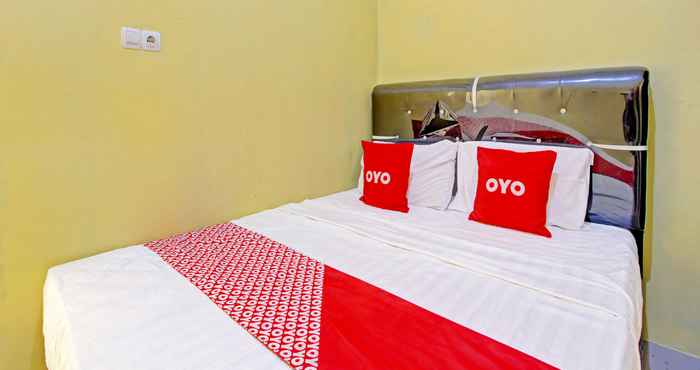 Bedroom OYO 91818 Papaya Kos