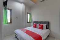 Bedroom OYO 91690 Moza Guest House