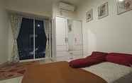 Bedroom 2 Apartemen Grand Kamala Lagoon by Hana