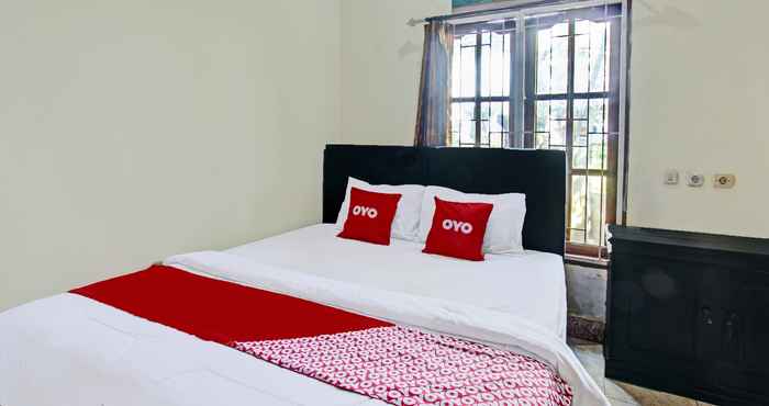 Kamar Tidur OYO 92059 Archi Homestay