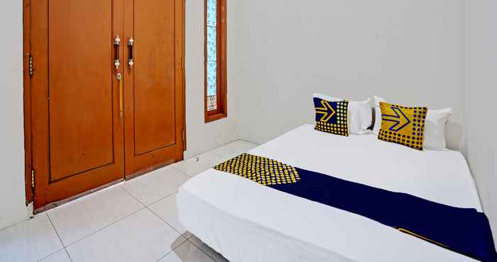 Kamar Tidur SPOT ON 92077 Tarlo Guest House 3