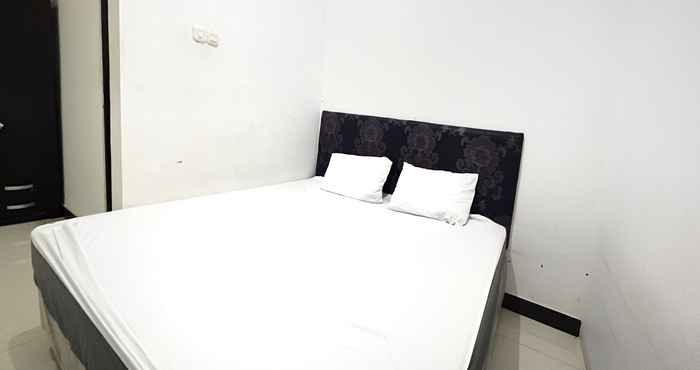 Kamar Tidur OYO 92100 Kost Biru