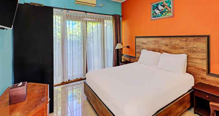 ห้องนอน OYO 92175 Surya Madu Guest House Near Pantai Kelan