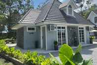 Bangunan OYO Home 90711 Roses Villa