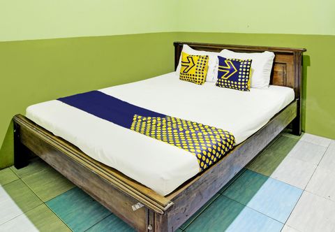 Bedroom SPOT ON 92264 Argo Homestay