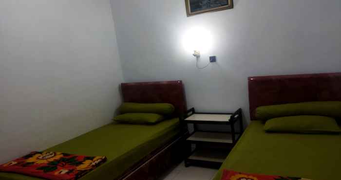 Kamar Tidur OYO 92337 Wisma Arwini Syariah