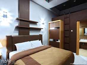 Bedroom 4 Home Inn Executive Residence