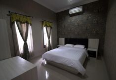 Bedroom 6 d'Madinah Guest House Gentan (Syariah)