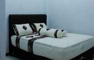 Kamar Tidur 5 First Kinara Hotel